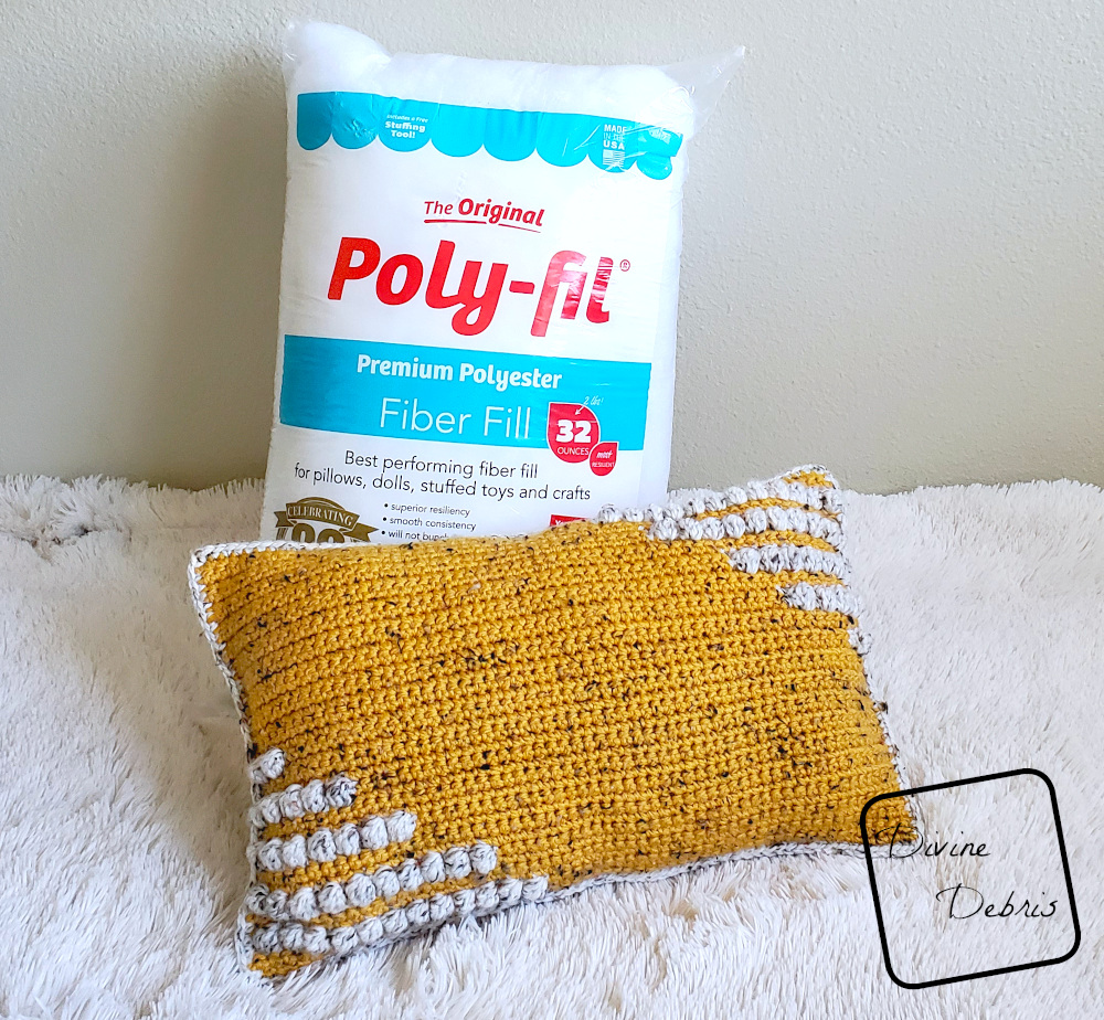 Learn to make the fun and squishy bulky weight yarn pillow, the Charismatic Pillow, from a free crochet pattern by DivineDebris.com