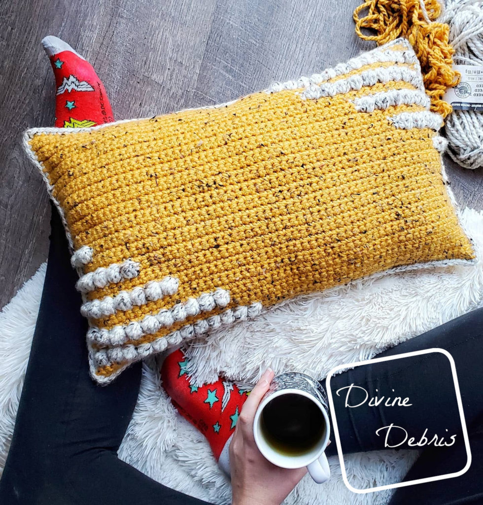 Learn to make the fun and squishy bulky weight yarn pillow, the Charismatic Pillow, from a free crochet pattern by DivineDebris.com