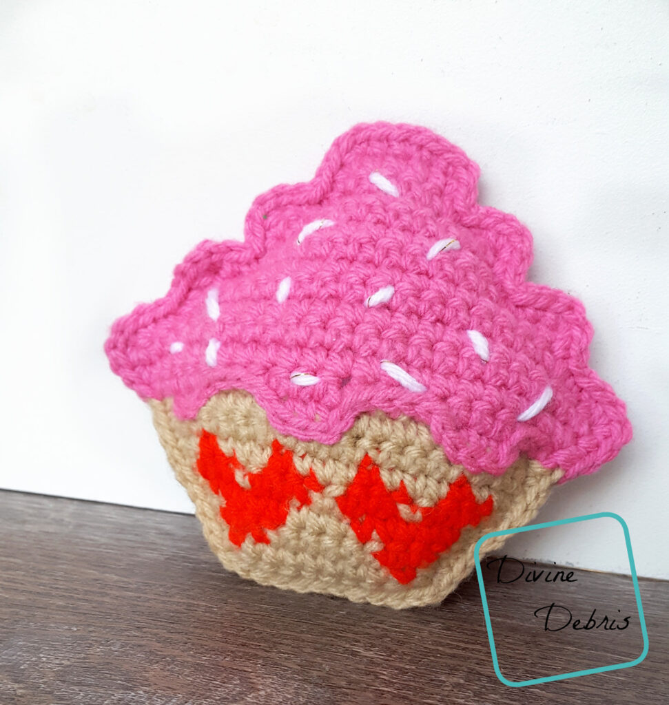 Learn to make a fun and silly Valentine's Day inspired crochet cupcake amigurumi, the Sweetheart Cupcake Ami, from a free crochet pattern 