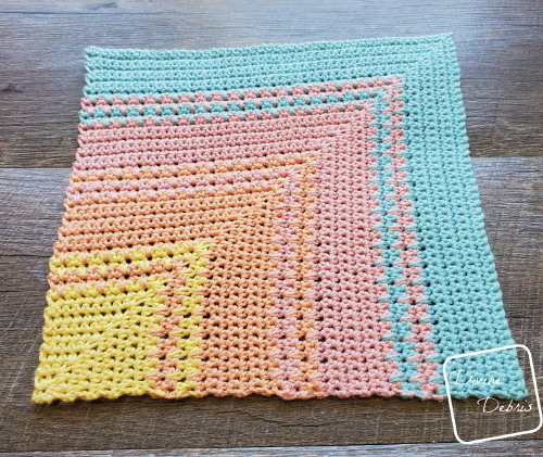 Learn to make a sunset inspired crochet washcloth with spike single crochets on DivineDebris.com